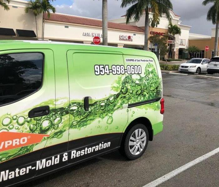 SERVPRO truck parked in a parking lot. 